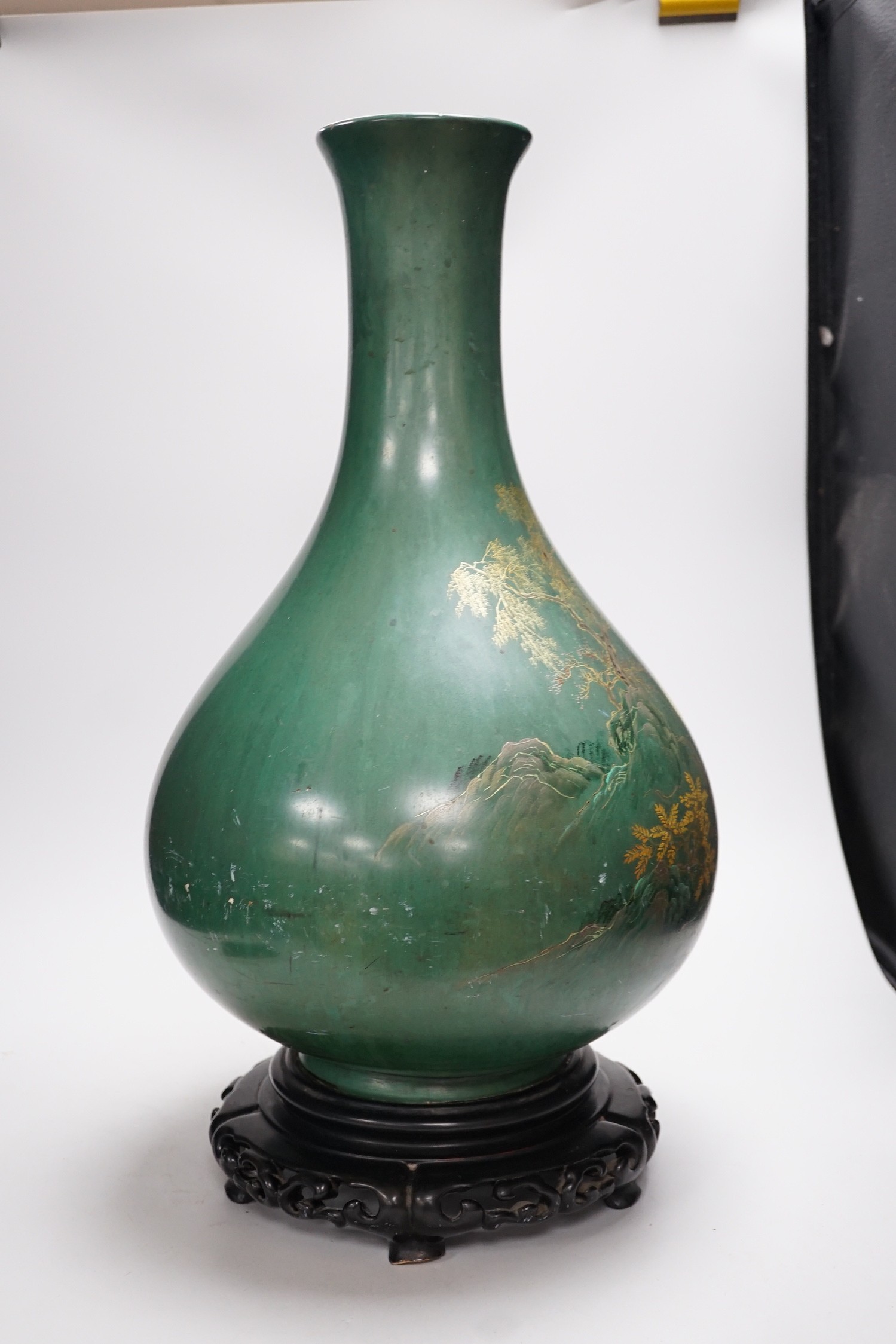 A large Chinese Fuzhou lacquer green ground vase and stand, early 20th century, 54 cm high